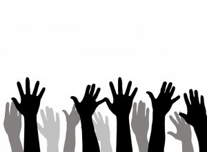 Image is an illustration of a group of raised hands.