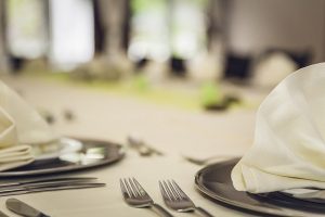 Image is a close up of a table set for a nice meal.